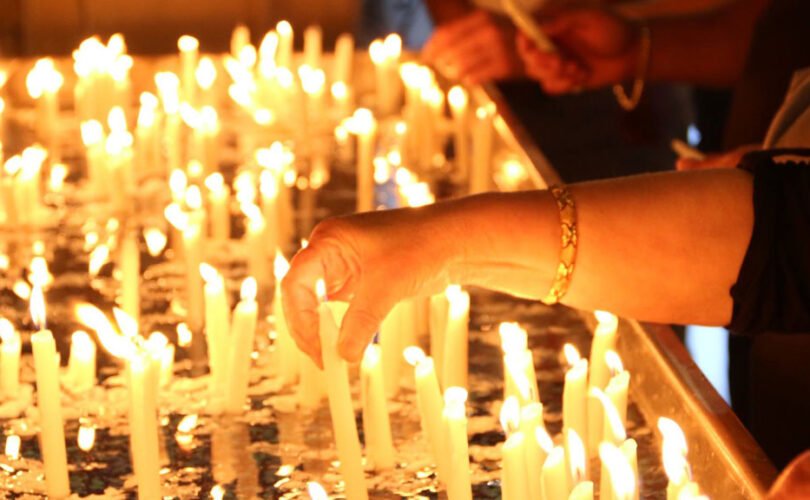 St. Mary's Armenian Apostolic Church Glendale, California. A place for prayer. Woman lighting candles.
